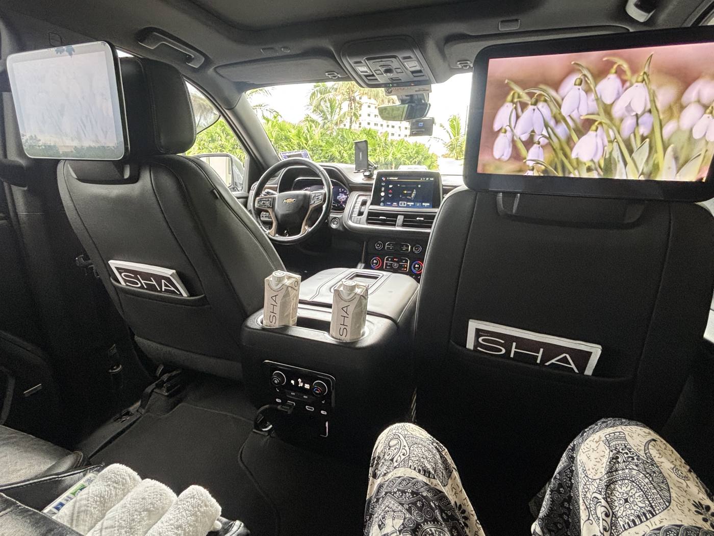 Inside the transfer: SHA water, cold towels, and an intro video on the screens